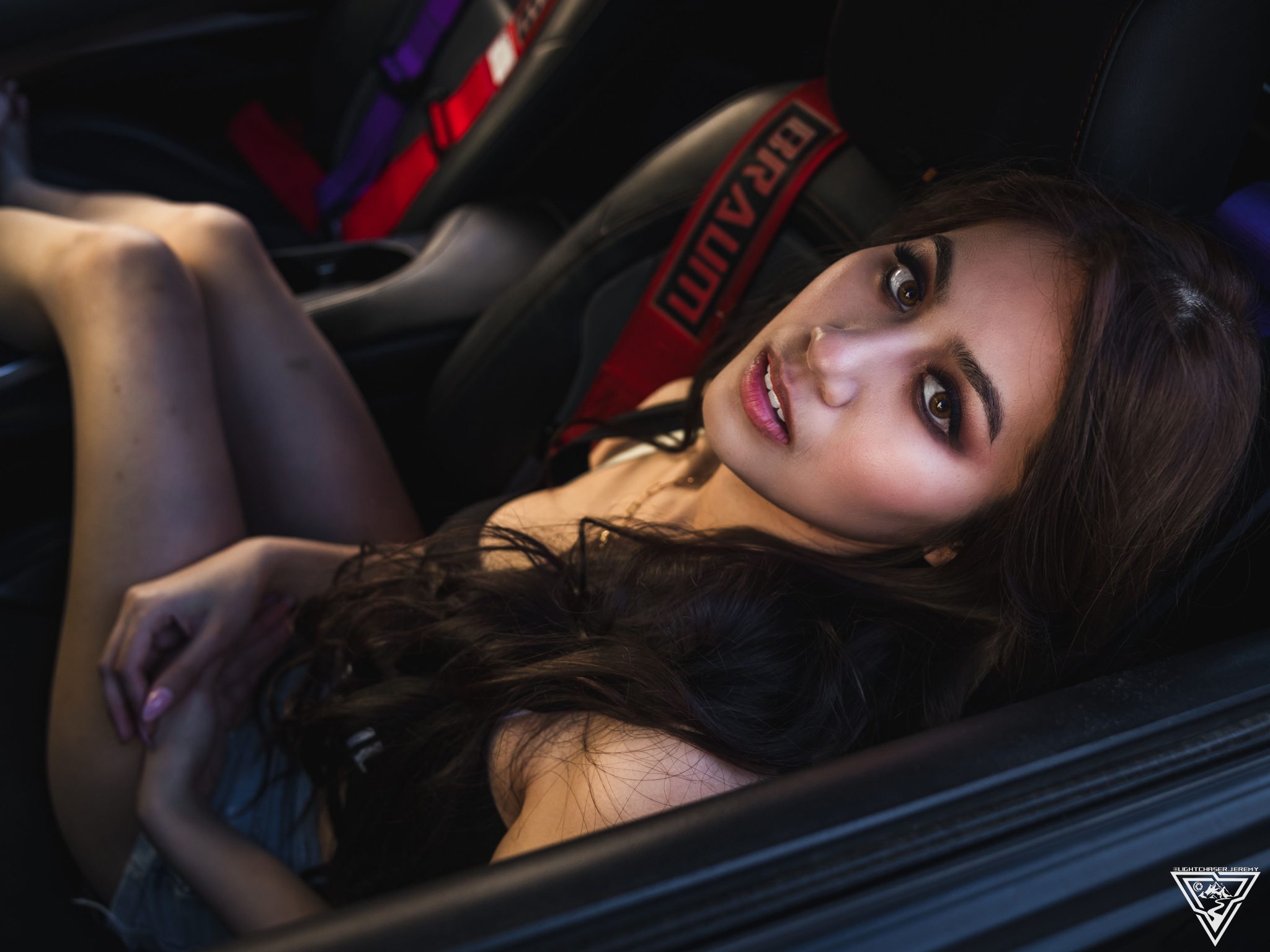 Joan Cruz photographed inside a car at night