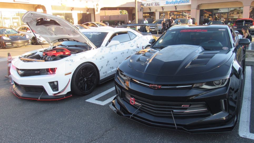 Widebody black Chevrolet Camaro parked at the Cafe 86 car meet