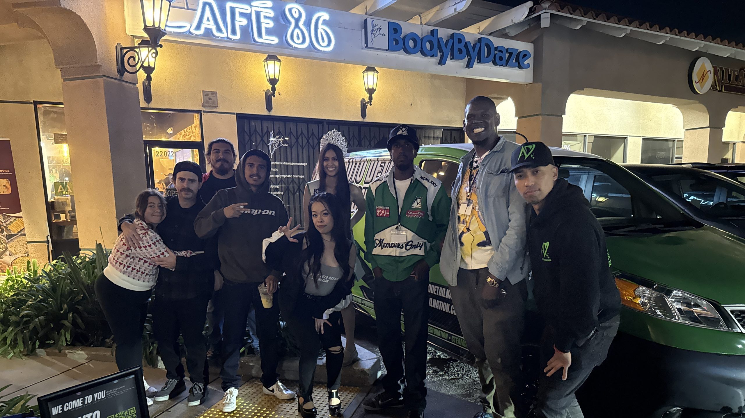 Attendees gathered outside Cafe 86 during the Auto Detail Nation car meet