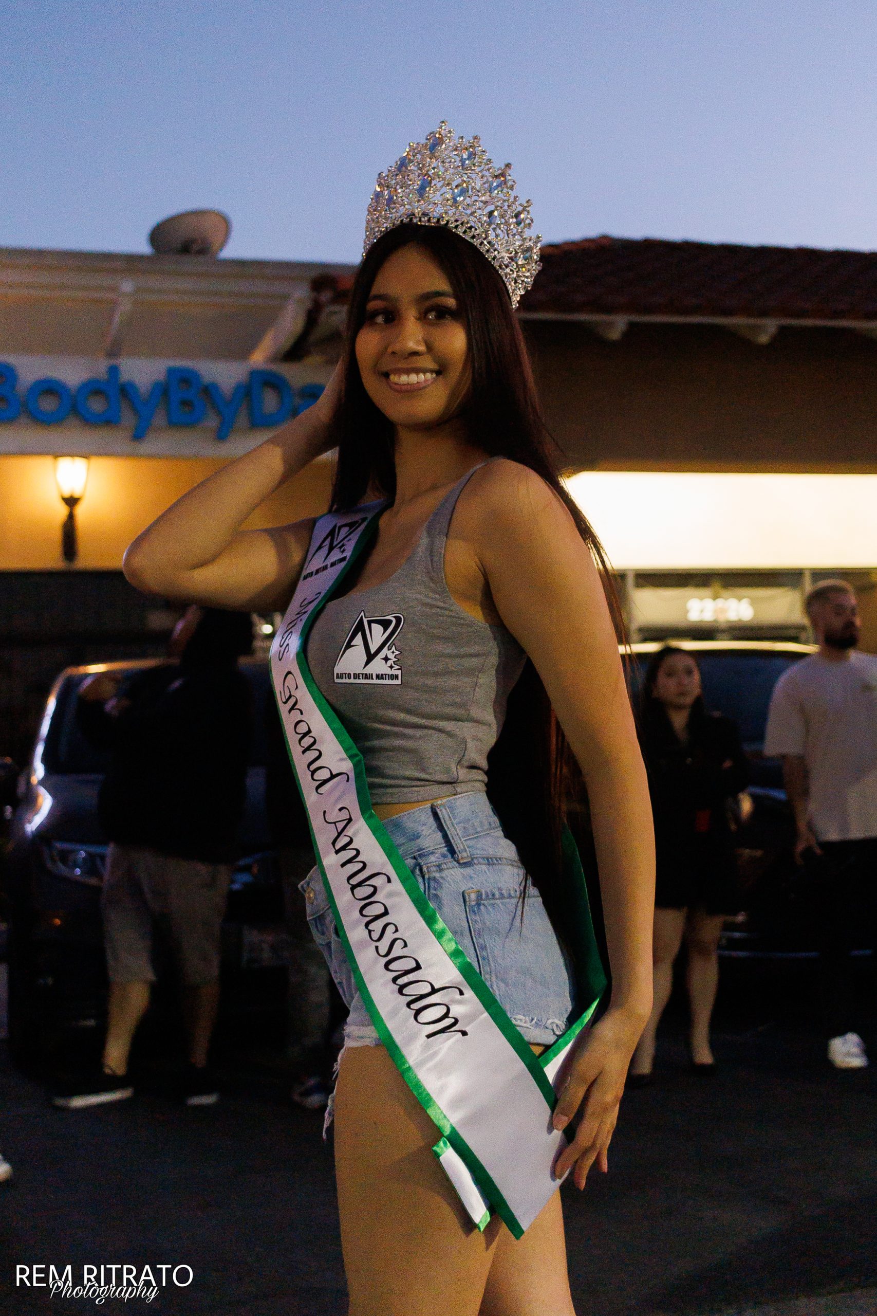 Joan Cruz wearing her Miss Grand Ambassador sash at the Cafe 86 car meet