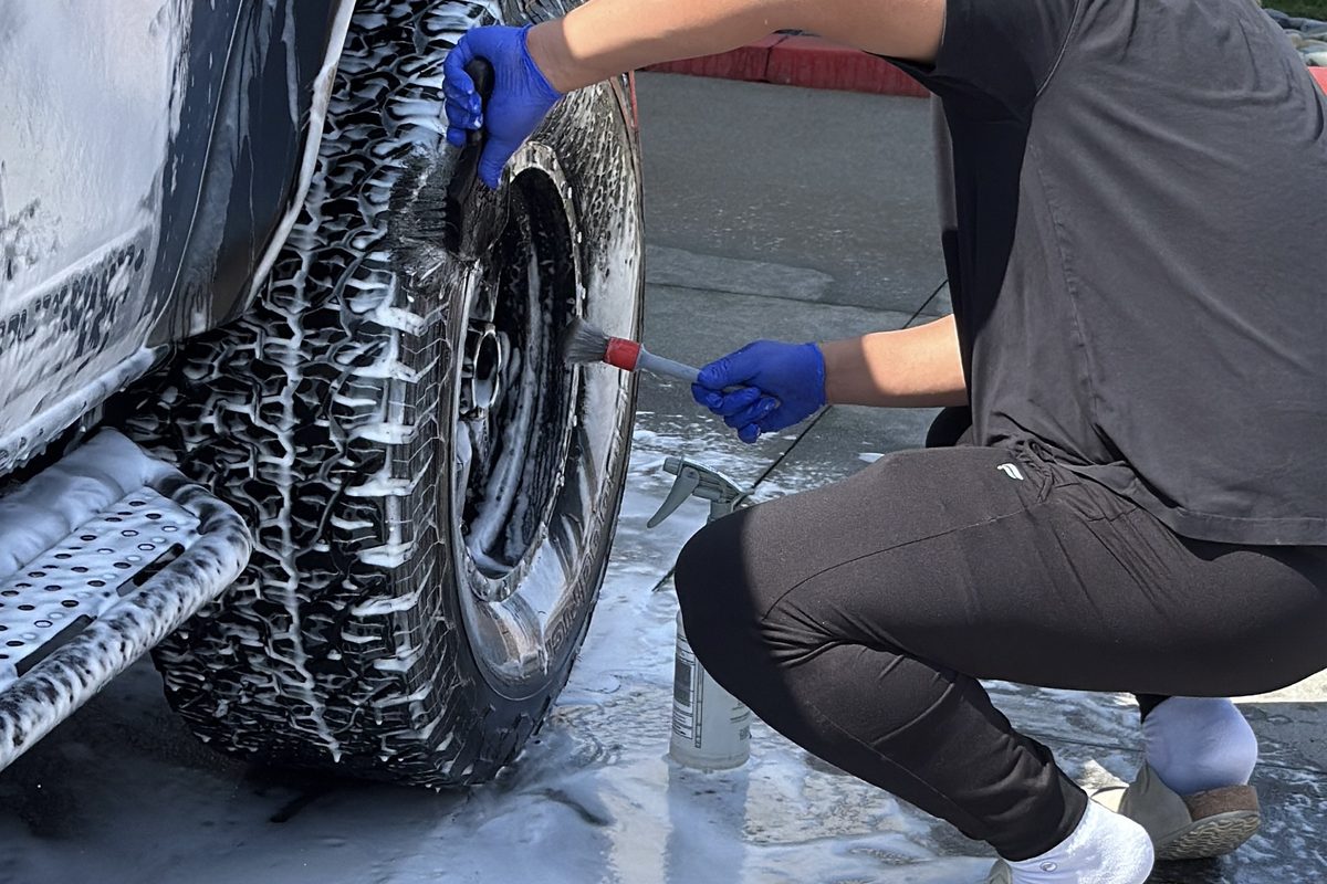 heel cleaning during a hand car wash - Auto Detail Nation